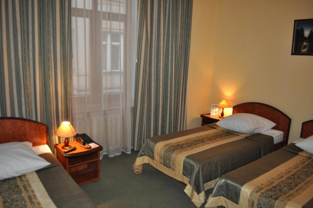 Wien Hotel Lviv Quarto foto